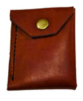 Burgundy leather minimalist with an antique brass snap on a white background