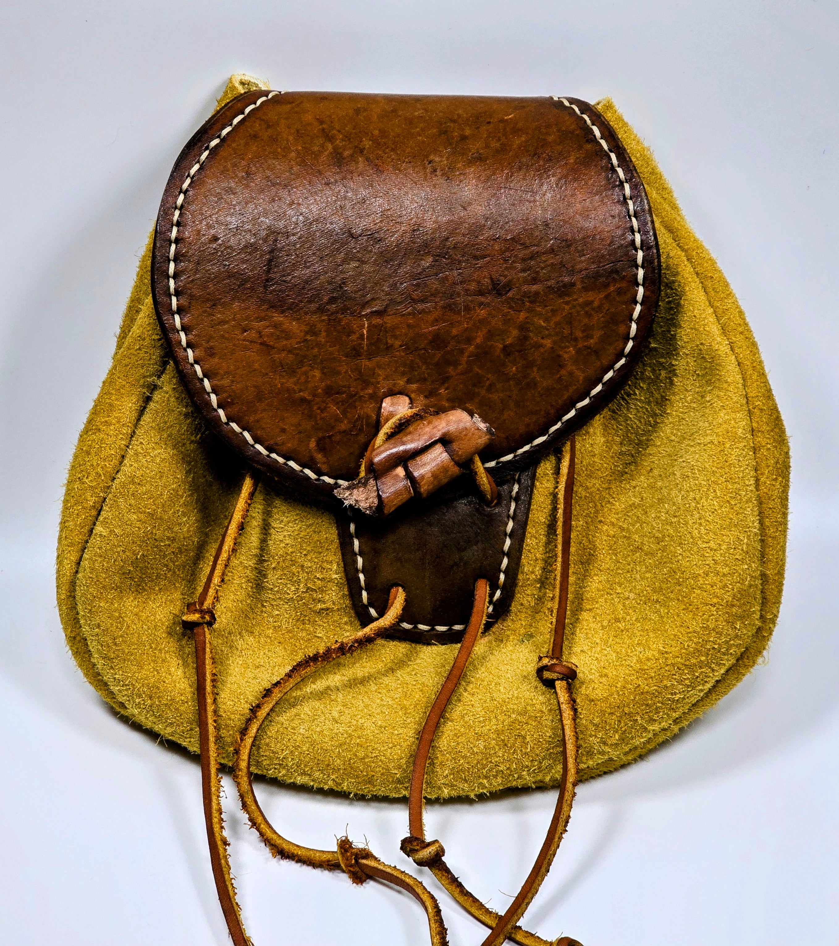 Sporran / belt pouch made with gold buffalo leather, brown cow leather, leather drawstring and leather closure