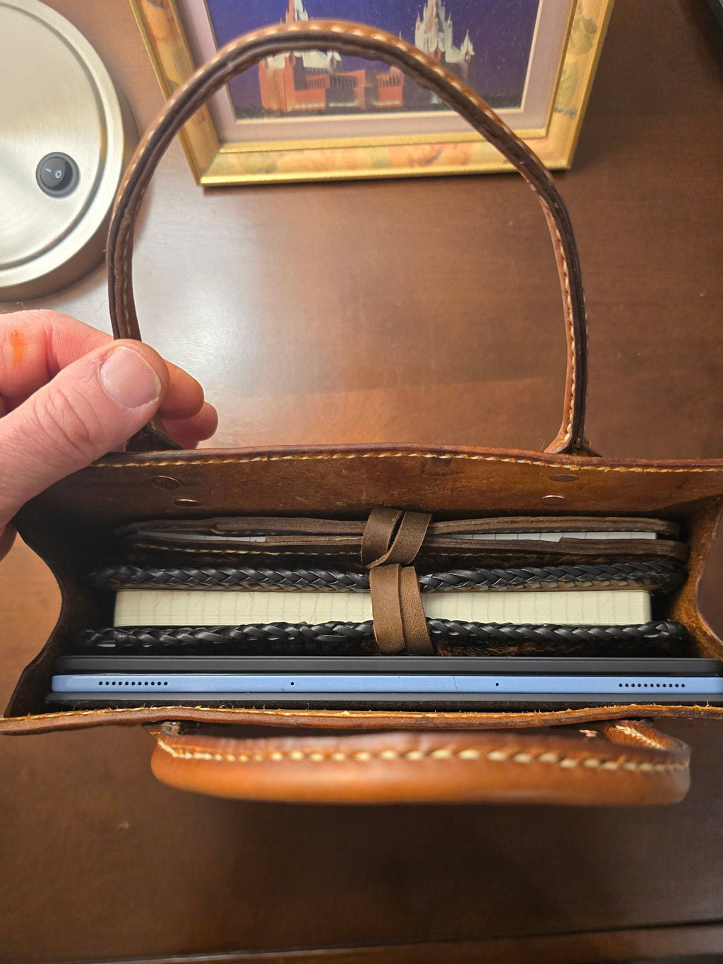 Hand-stitched vintage style leather book tote in rich brown veg tan leather, showing durable handles and clean stitching
