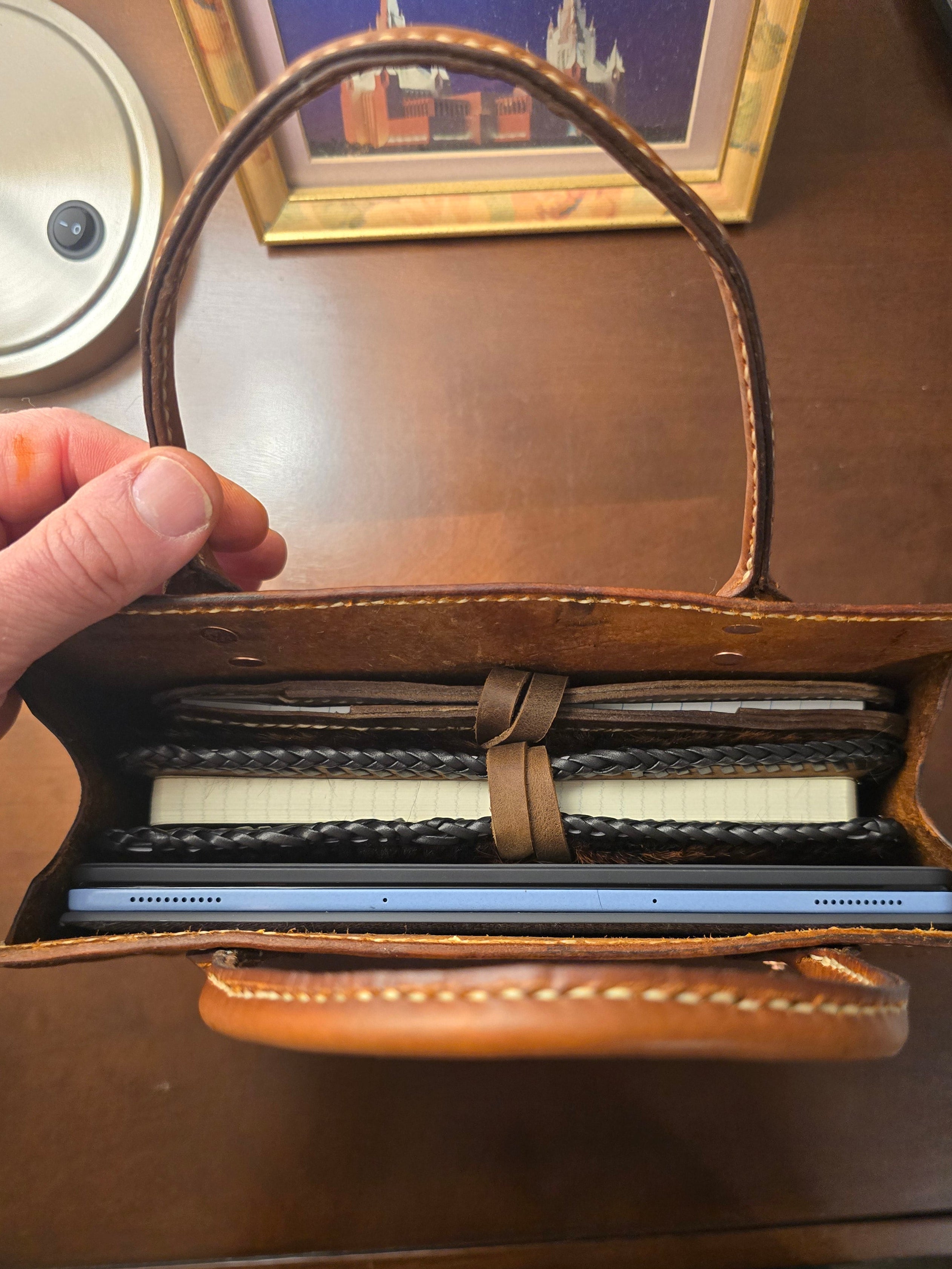 Hand-stitched vintage style leather book tote in rich brown veg tan leather, showing durable handles and clean stitching