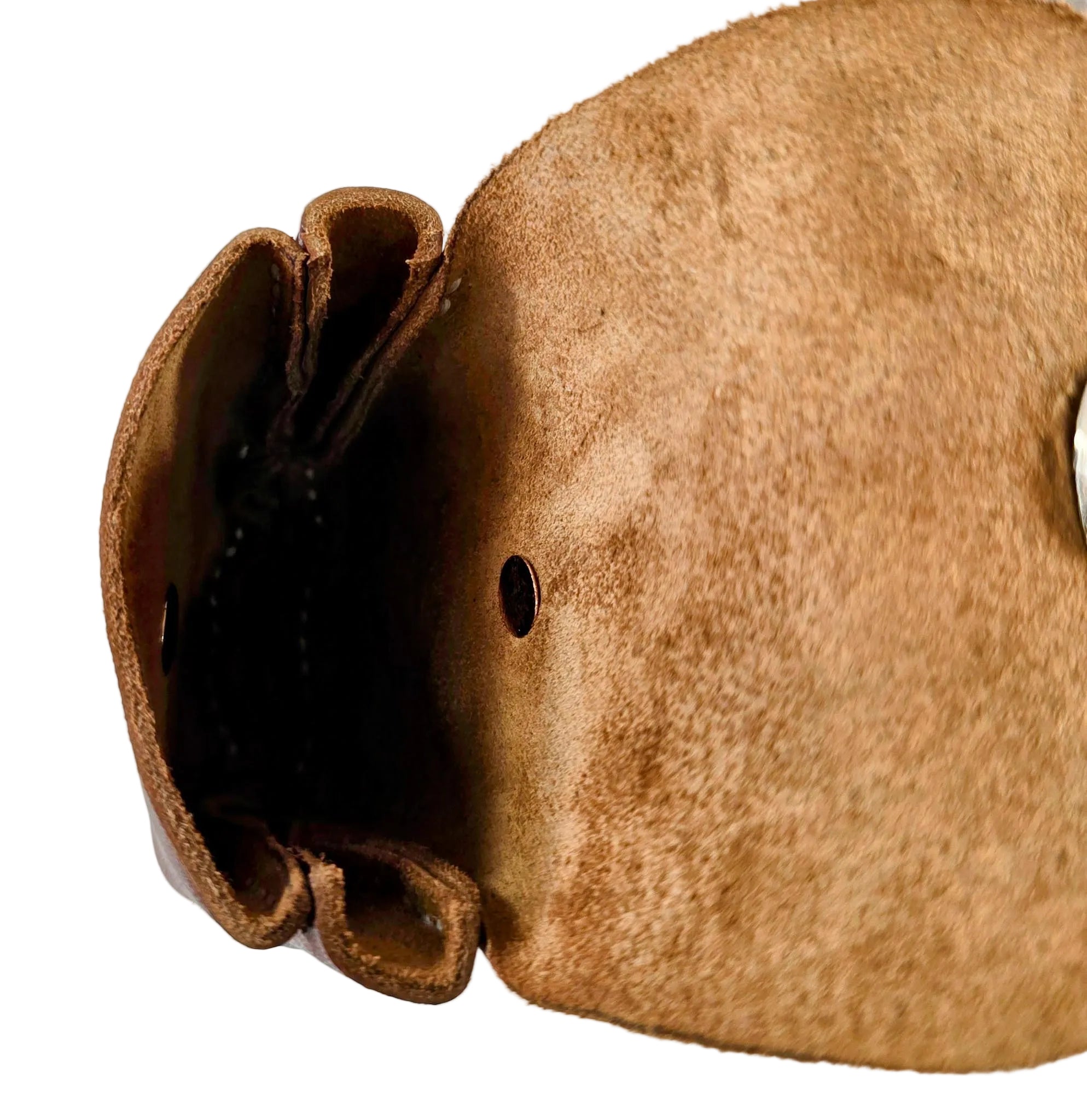 Close-up of a brown leather mini purse with a textured surface on a white background