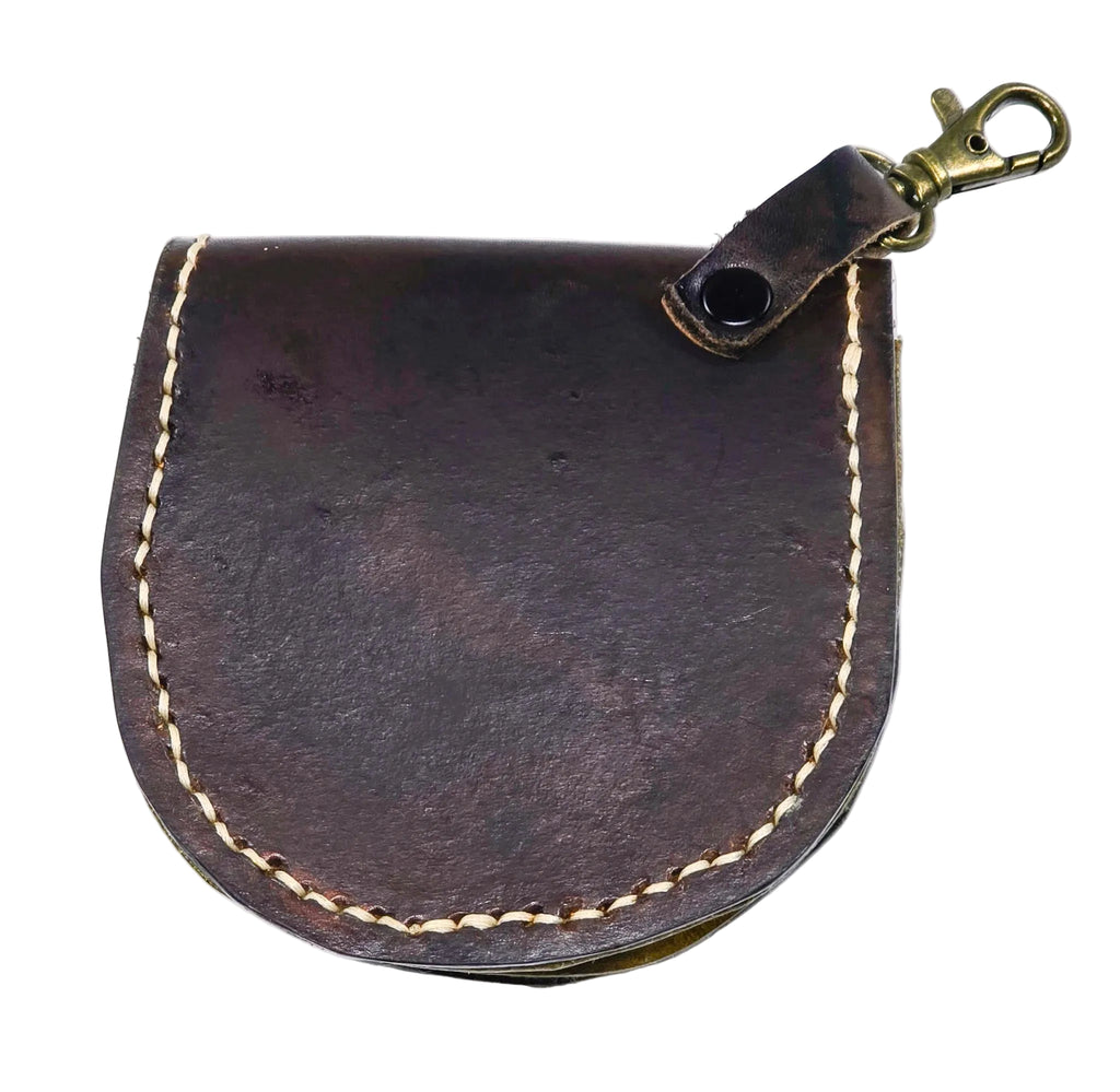 Handmade Tiny Critter leather coin purse with a two-tone dyed finish, featuring attached eyes and teeth details for a fun monster-inspired look.
