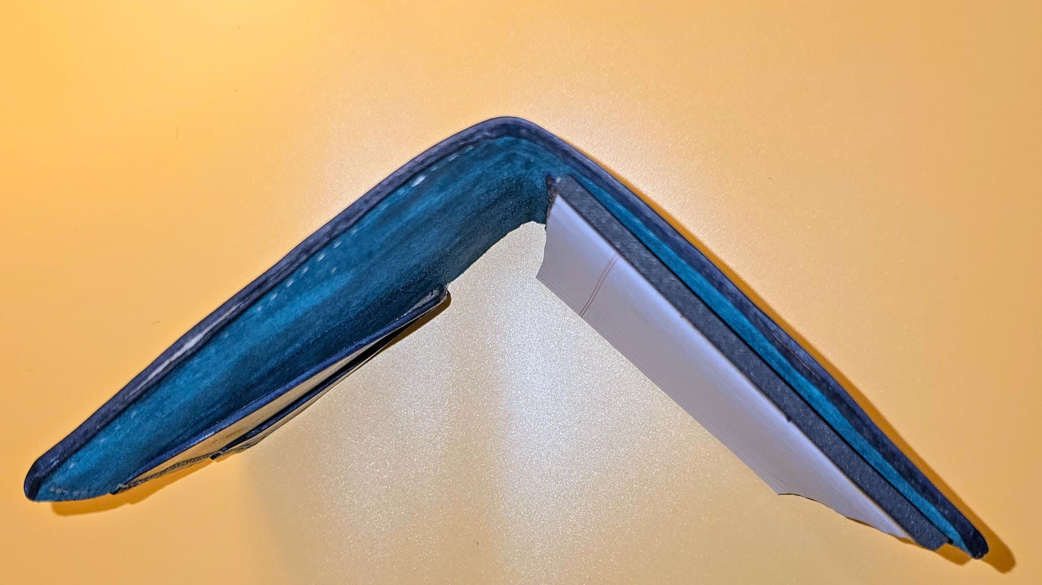 Hand-dyed leather mini padfolio with a unique, rich finish.