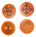 Set of 4 handmade full-grain vegetable tanned leather coasters featuring Celtic knotwork designs – Celtic lion, Celtic cross, Tree of Life, and triskelion spiral