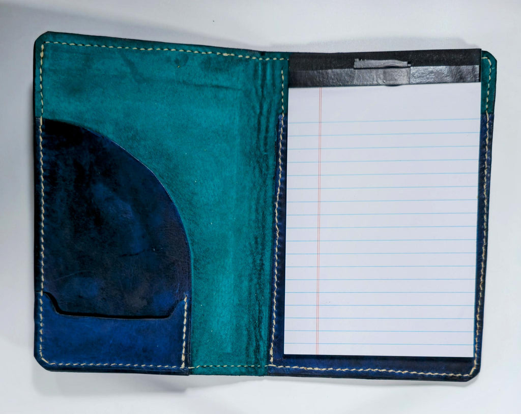 Open view of Hand-dyed leather mini padfolio with a unique, rich finish showing a turquoise pig suede liner.