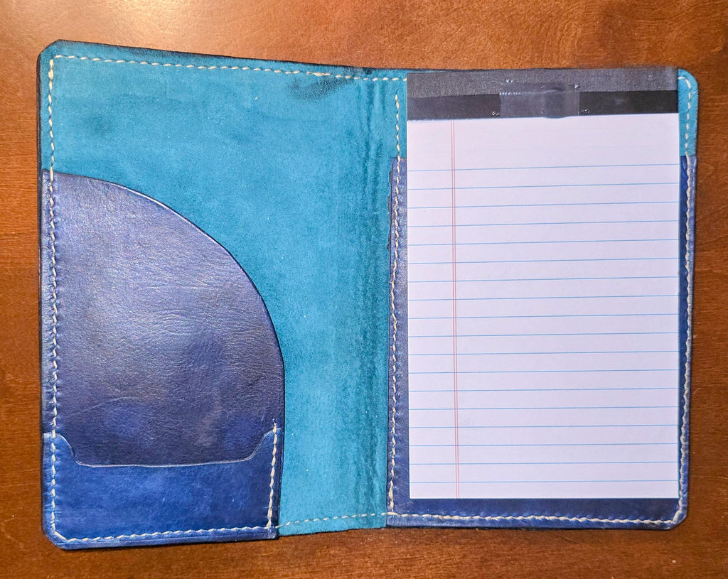 Open view of Handcrafted leather mini padfolio, professional blue leather, with pig suede liner portfolio on a wood surface 