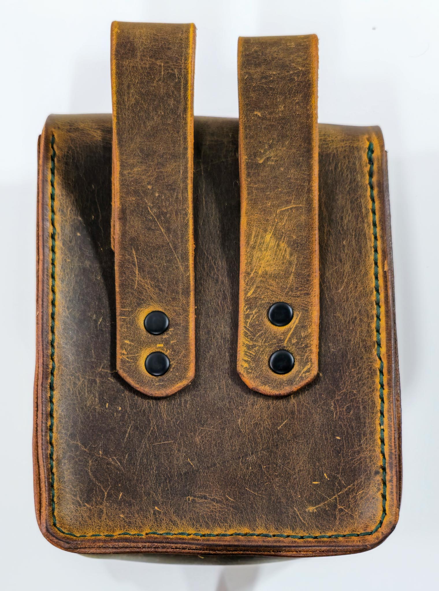 Back view of handcrafted leather belt pouch showing strap detail